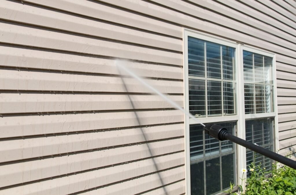 Crew from Refresh Power Washing cleaning driveway, siding, and walkways in Northampton County, PA to restore appearance.